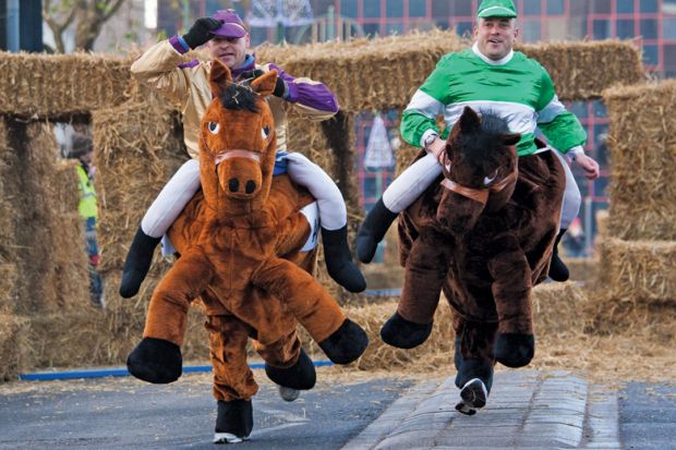 Men competing in pantomime horse race, Birmingham