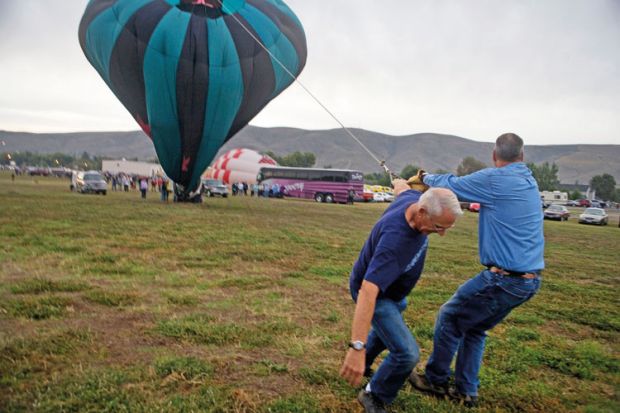Men deflating hot air balloon, Great Prosser Balloon Rally