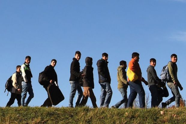 Migrants walking to registration point, Germany