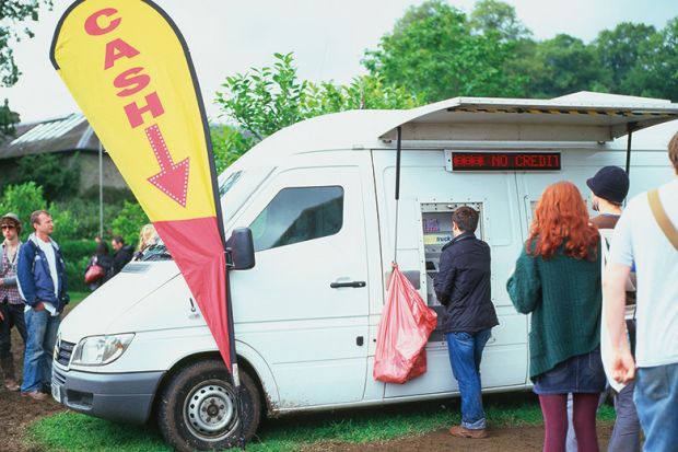 Mobile cash machine white van at the Green Man Festival Wales UK