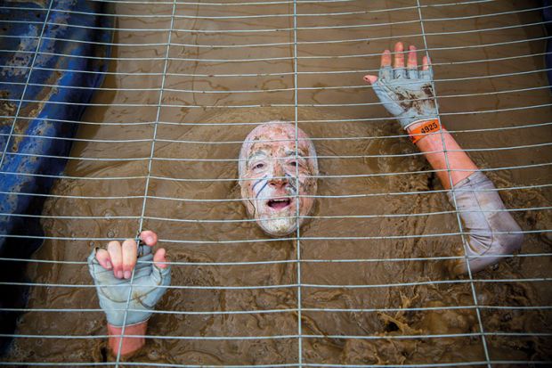 Muddy obstacle in Tough Mudder race