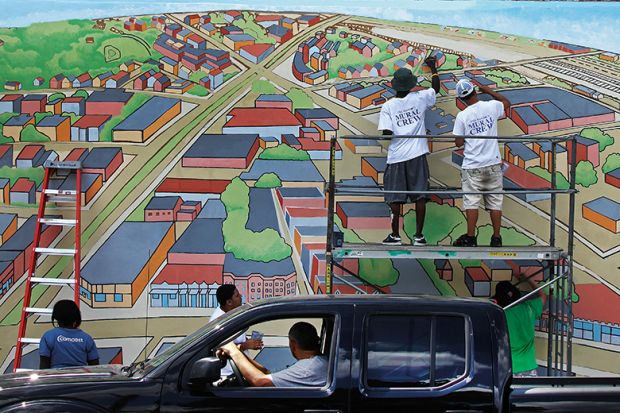 ‘Bird’s Eye View of Allston Village’ is on the side of a building in Cambridge, Mass
