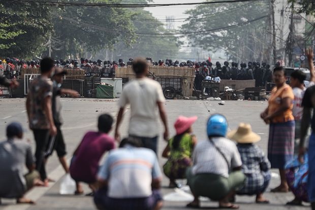 Myanmar riot police blocked the road in front of the protesters during a protest against the military coup in Yangon, Myanmar on March 3, 2021.