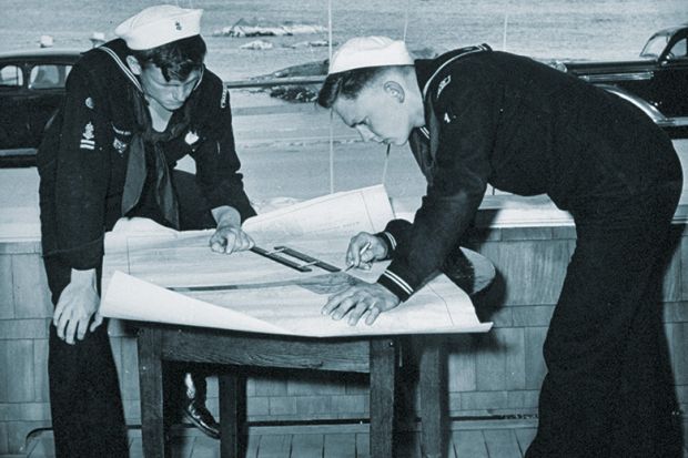 Naval officers with chart