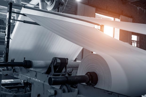 Paper being processed in paper mill