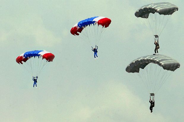 People using parachutes. To illustrate people being placed in to new senior management roles to tackle big issues such as sustainability and diversity.