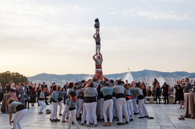 People forming human tower, Young Universities Summit 2016
