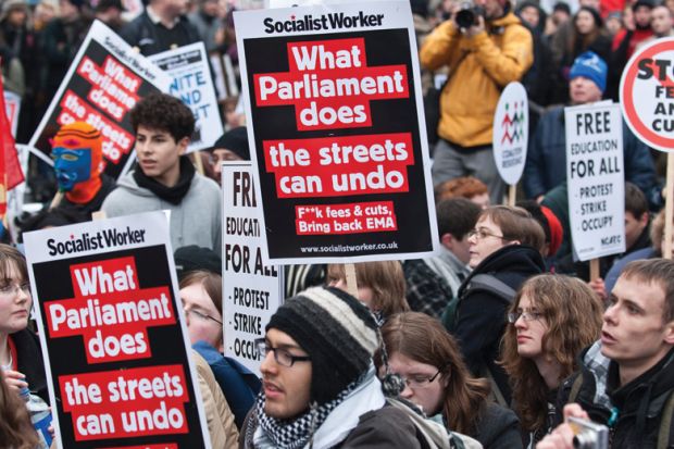 People holding signs at a protest