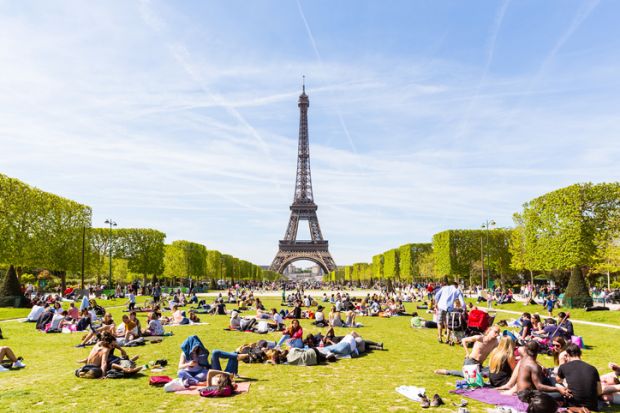 People on Champ de Mars with Eiffel Tower in background