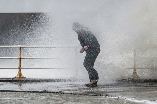 Person caught in spray of wave, Worcester, England