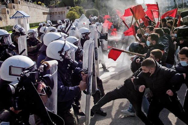 Clashes between demonstrators and riot police during the university students protest against the government-promoted university police in universities in Athens, on February 10, 2021. 
