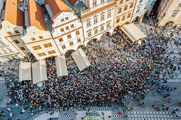 Aerial view of crowd in a square in Prague, Czech Republic to illustrate increasing international student mobility in Europe