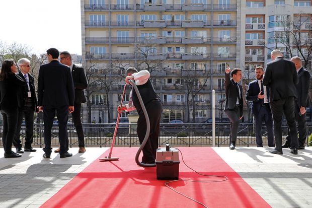 Hoovering a red carpet