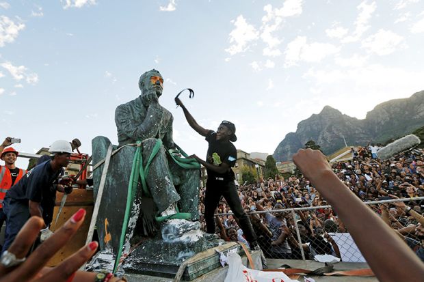 Activists deface a statue of Cecil John Rhodes at UCT