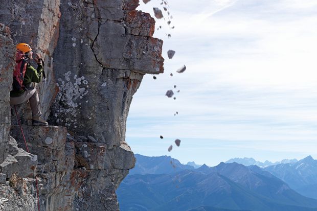 Rocks falling with cliff climber
