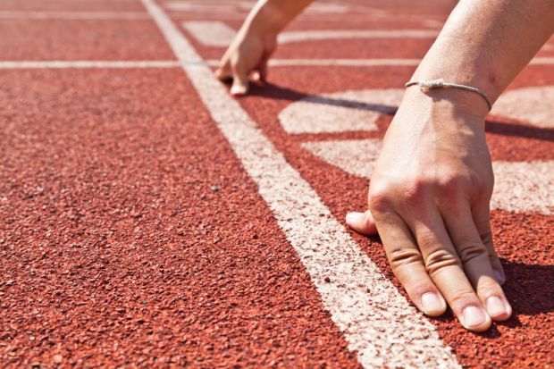 Runner's hands placed in race starting position