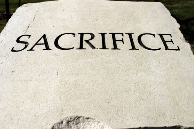'Sacrifice' engraved on stone tablet