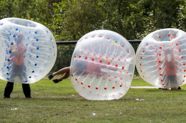 Saint John, New Brunswick, Canada - August 26, 2017 Events at the Dragon Boat Festival. People play bubble soccer.