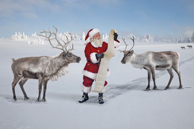 Santa checking list with reindeer