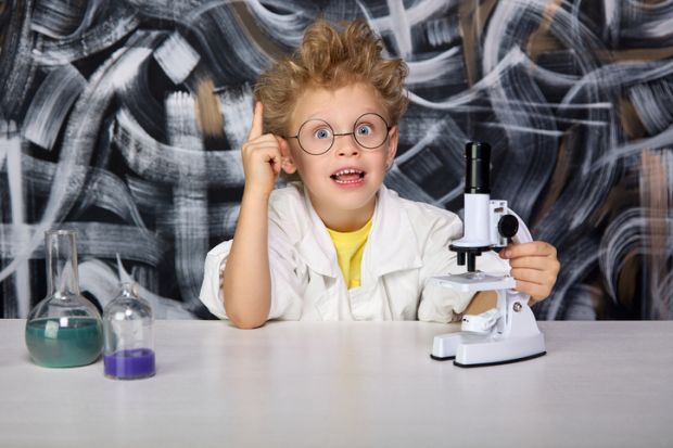 A young boy does a science experiment