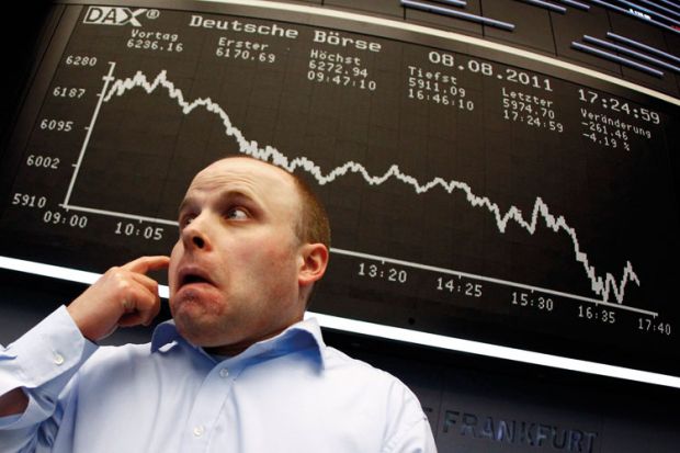 Trader reacts to DAX index board, Frankfurt stock exchange