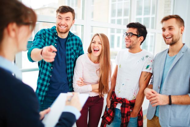 Students pointing and laughing at teacher