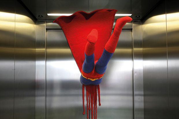 Superman flying into a closed lift door