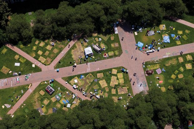 Marks left by tents on campus lawn