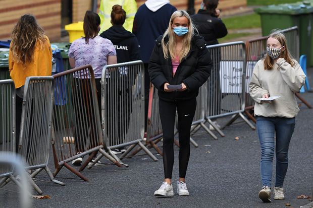 Students walk at a pop-up testing centre for Covid-19 in Glasgow, Scotland on September 24, 2020