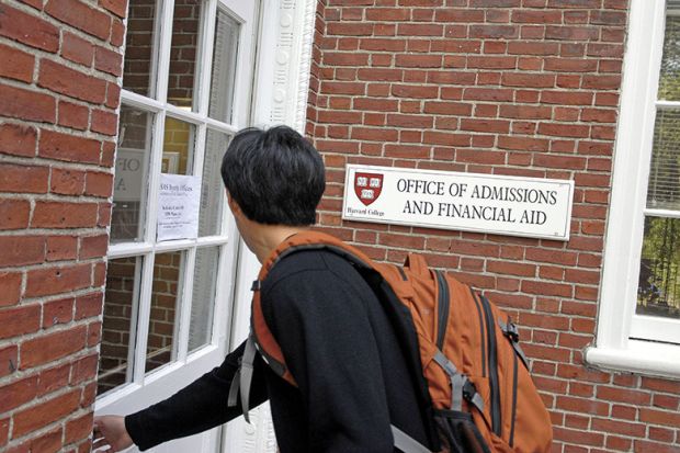 Freshman entering Harvard admissions building