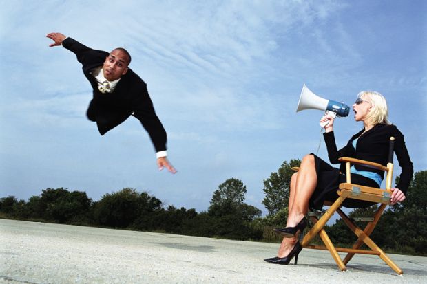 Businesswoman with megaphone shouting at man flying, outdoors