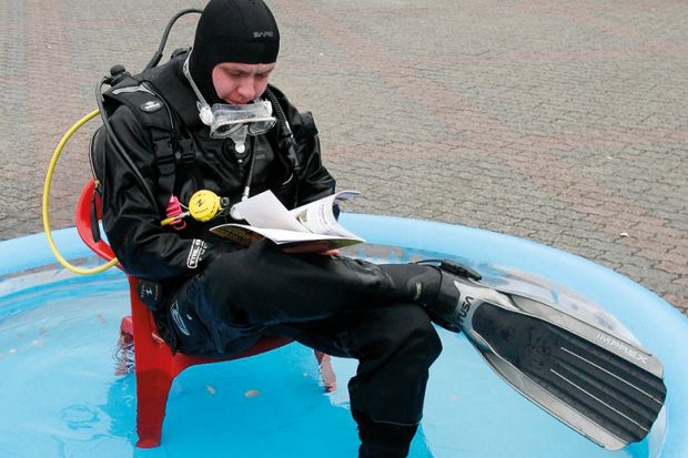 Scuba diver in a paddling pool