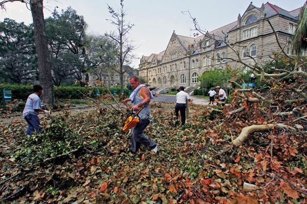 Workers remove debris at Tulane University after Hurricane Katrina
