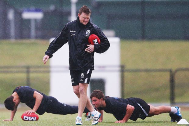 Rugby players doing press-ups
