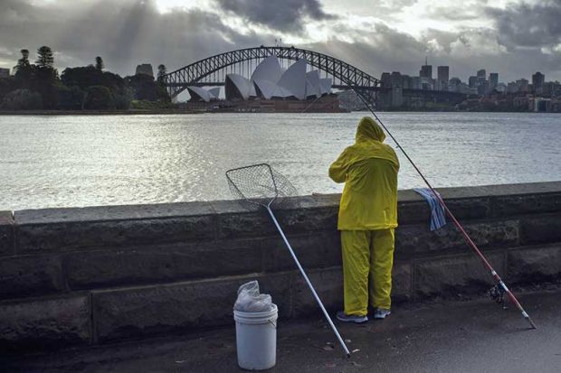 Fisherman overlooking Sydney Harbour