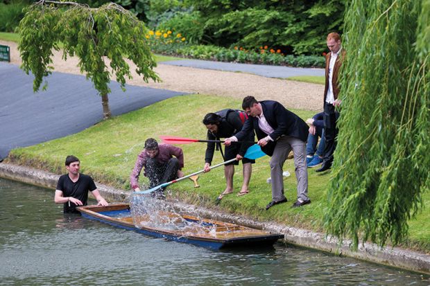 Cambridge University students on the River Cam. Punt is sinking