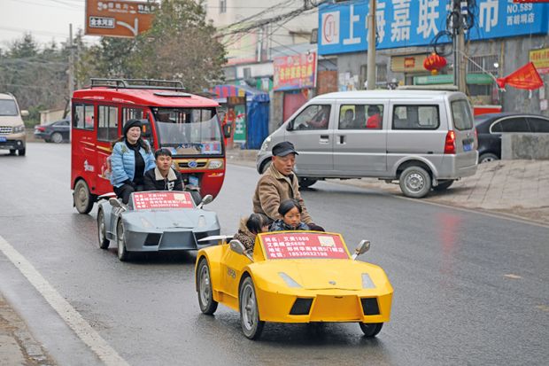 A farmer and his wife drive his miniature home-made Lamborghini. China