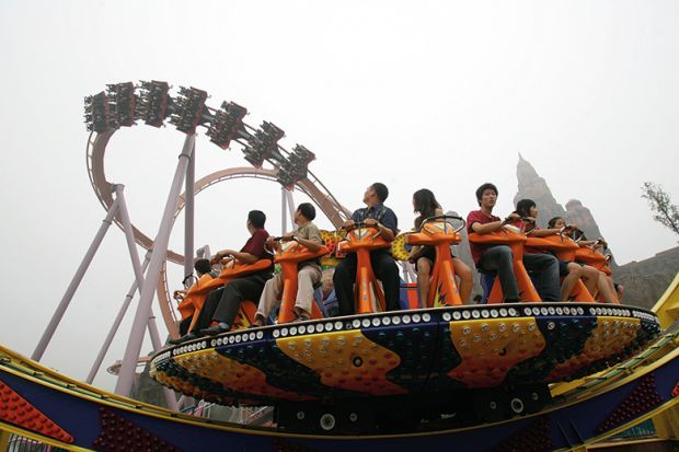 Tourists enjoy the amusement facilities at Chinese Theme Park, Beijing of China