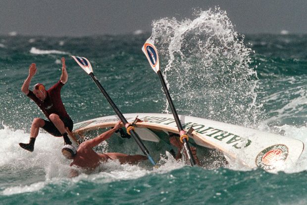 Boat crew come to grief during the Semi Finals of the Open Boat Race, Kurrawa Beach, Surfers ParadIse, Australia