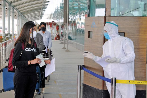 Checking passports during the coronavirus pandemic