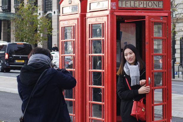 Tourist in a phone box