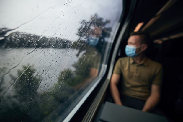 Passenger on a train wearing a face mask