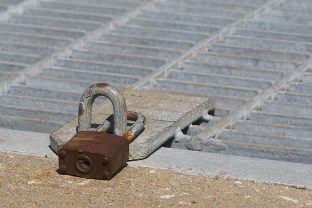 A locked trapdoor illustrating potential downgrade of Chinese PhD students to a master’s programme