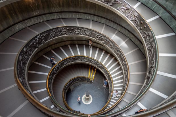 Vatican, Vatican - June 14 2019 People on Bramante Double Helix Staircase in Vatican Museums in the Vatican City.