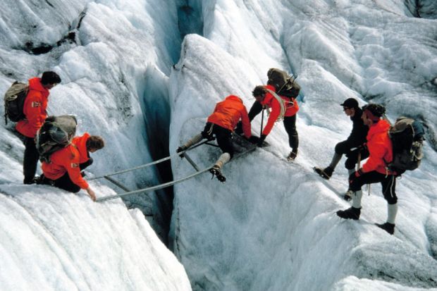 A group navigating a crevasse in Norway to illustrate Norway budget: students given more support but research funds cut