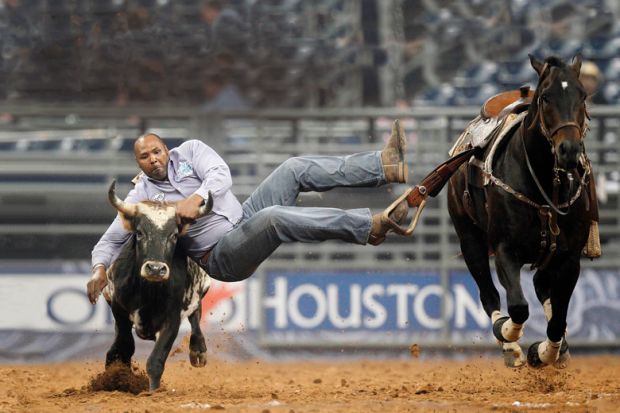 Darrell Petry leaps off his horse as he competes in Steer Wrestling during the Rodeo Houston BP Super Series II, in Houston to illustrate Fixing America’s broken credit transfer system