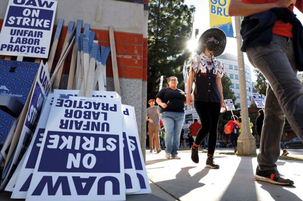 Union academic workers and supporters march at the UCLA campus as described in the article