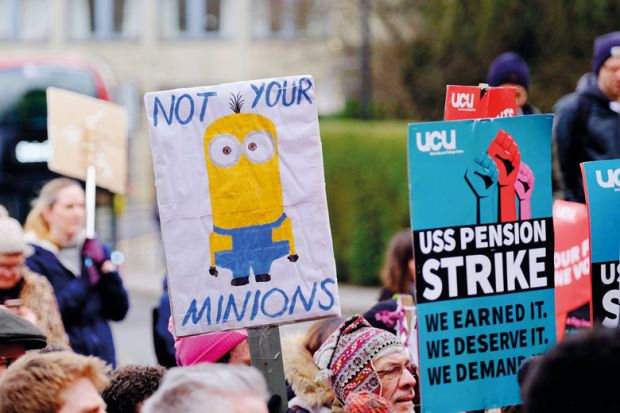 The University and College Union (UCU) lecturer strike protestors holding banners with one reading 'not your minions' to illustrate UEL pledges review after settling with sacked union members