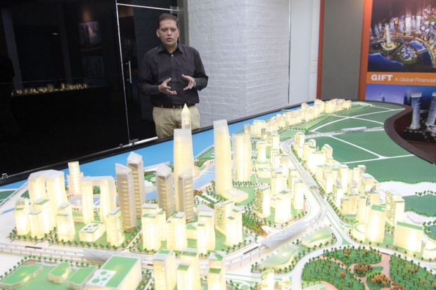 Dipesh Shah, Vice President of GIFT shows a model of GIFT City in Gandhinagar, India to illustrate India’s regulation-free city offers blueprint for branch campuses