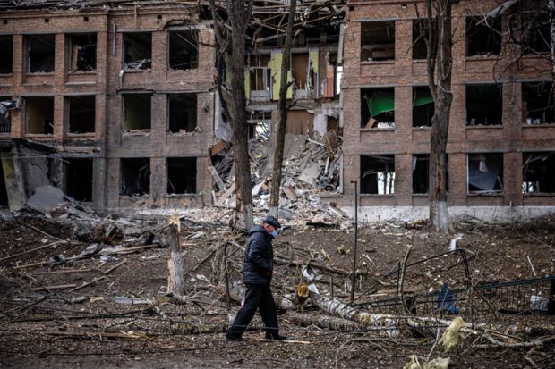 A man walks in front of a destroyed building after a Russian missile attack in the town of  Vasylkiv, near Kyiv, to illustrate Russia faces ‘devastating’ research isolation